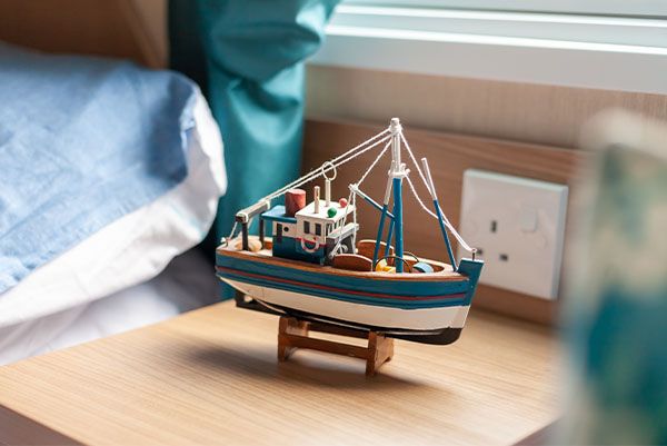 Photo of a little toy wooden boat.